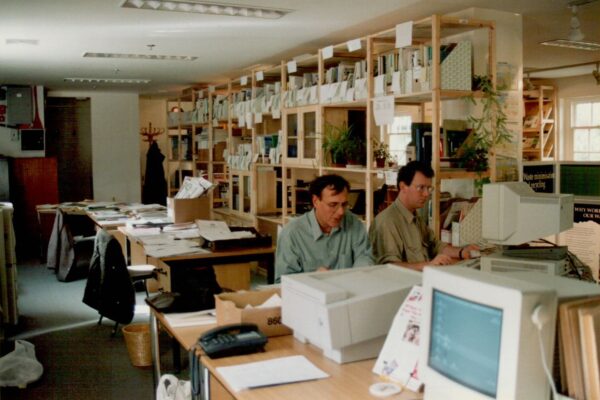 Two men at a computer in the early office of what was Southampton Environment Centre