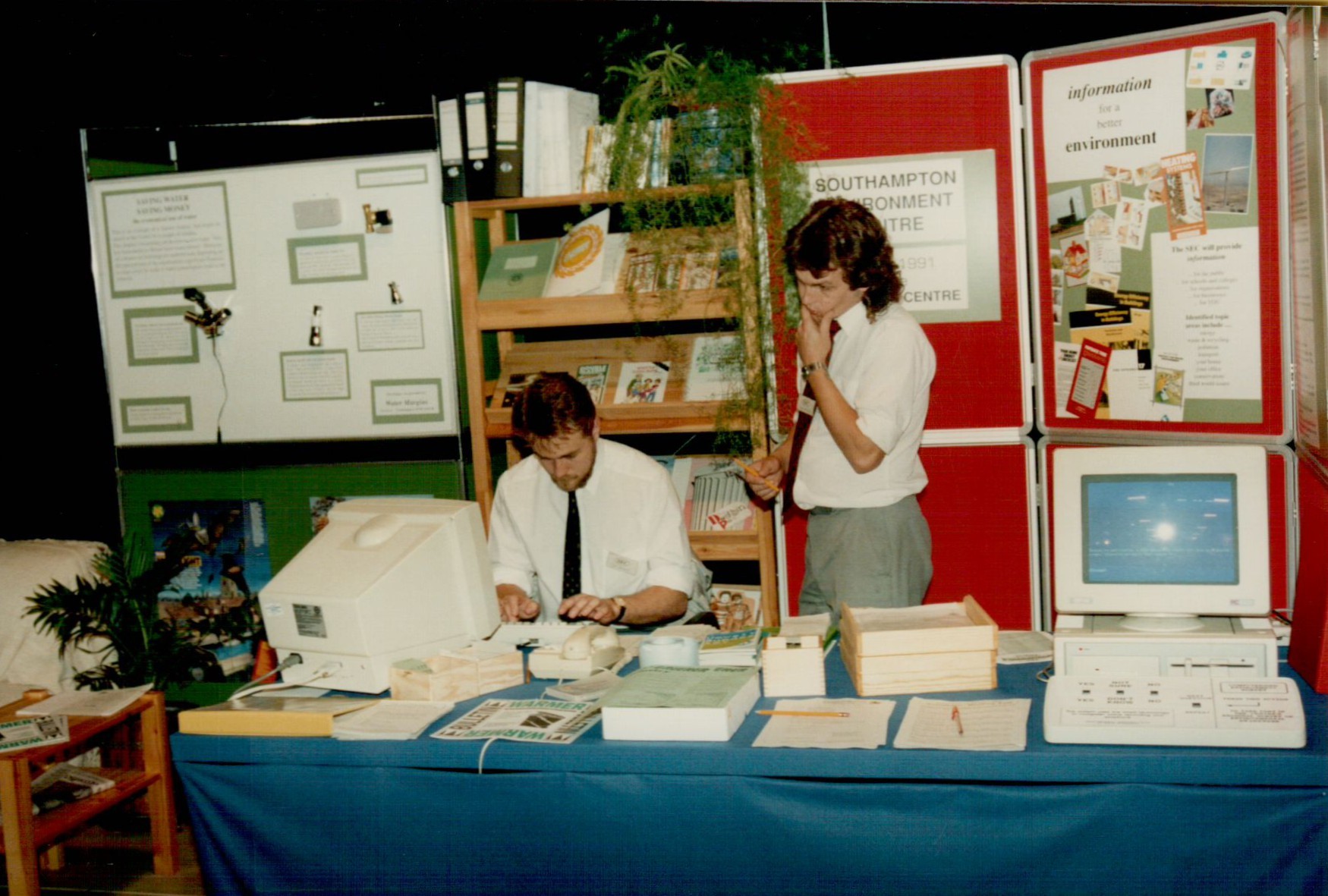 Office staff in the early days working on bulky computer monitors.